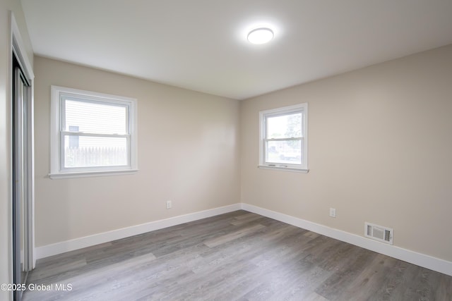 1041 Madison Ave, Troy, NY 12180 - unfurnished bedroom with wood finished floors and a closet