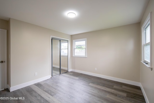 1041 Madison Ave, Troy, NY 12180 - unfurnished bedroom with wood finished floors and a closet