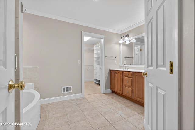 10 Sweetbriar Dr, Wilton, NY 12831 - full bathroom with vanity, a bath, ornamental molding, tile patterned flooring, and a walk in closet