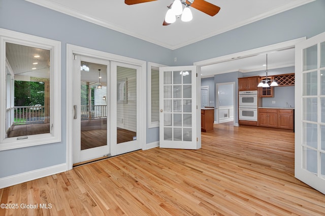 10 Sweetbriar Dr, Wilton, NY 12831 - empty room featuring french doors, light wood finished floors, ornamental molding, and a ceiling fan