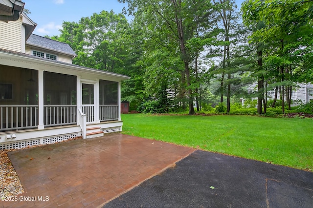 10 Sweetbriar Dr, Wilton, NY 12831 - view of grassy yard featuring a sunroom and a patio