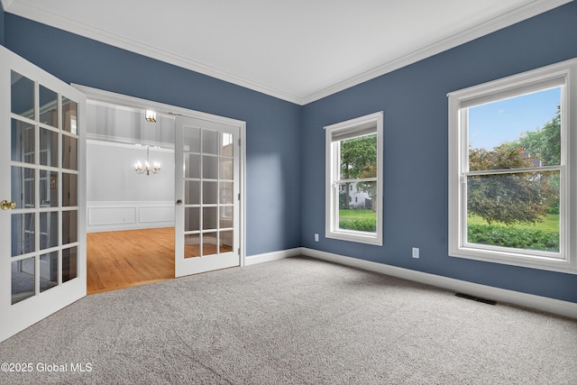 10 Sweetbriar Dr, Wilton, NY 12831 - carpeted spare room with crown molding, a chandelier, and french doors