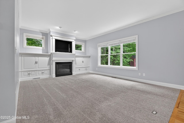 10 Sweetbriar Dr, Wilton, NY 12831 - unfurnished living room with crown molding, plenty of natural light, and a glass covered fireplace