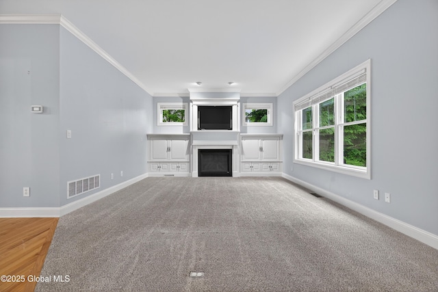 10 Sweetbriar Dr, Wilton, NY 12831 - unfurnished living room featuring crown molding, carpet floors, and a fireplace