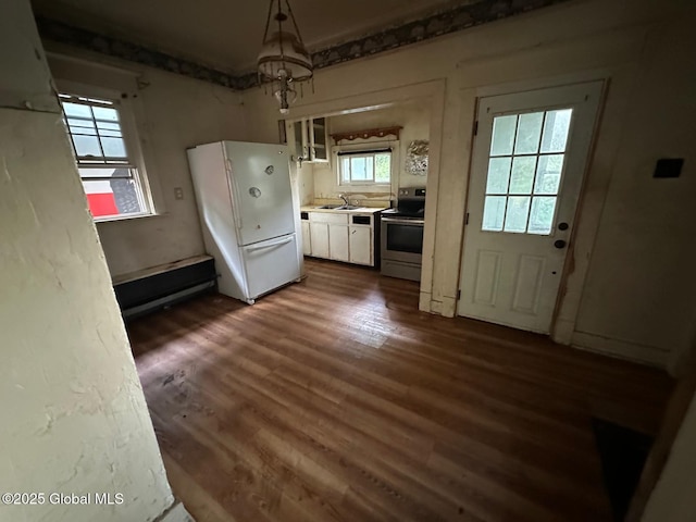 7 Frost Pl, Albany, NY 12205 - kitchen featuring freestanding refrigerator, stainless steel electric stove, white cabinetry, dark wood-style floors, and light countertops