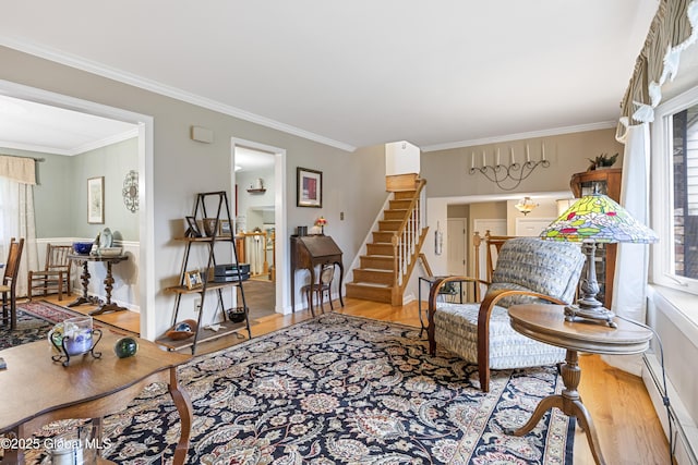 6458 Vosburgh Rd, Guilderland, NY 12009 - living area with wood finished floors, crown molding, stairs, and a baseboard radiator