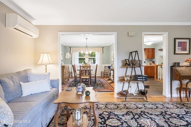 6458 Vosburgh Rd, Guilderland, NY 12009 - living room with a wall mounted AC, light wood-style flooring, crown molding, and a chandelier
