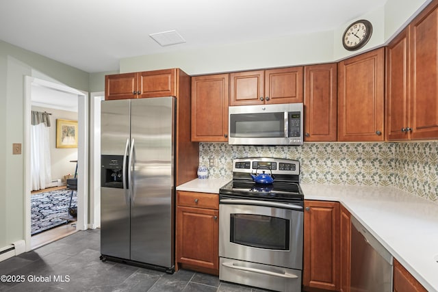 6458 Vosburgh Rd, Guilderland, NY 12009 - kitchen featuring stainless steel appliances, light countertops, decorative backsplash, and brown cabinets