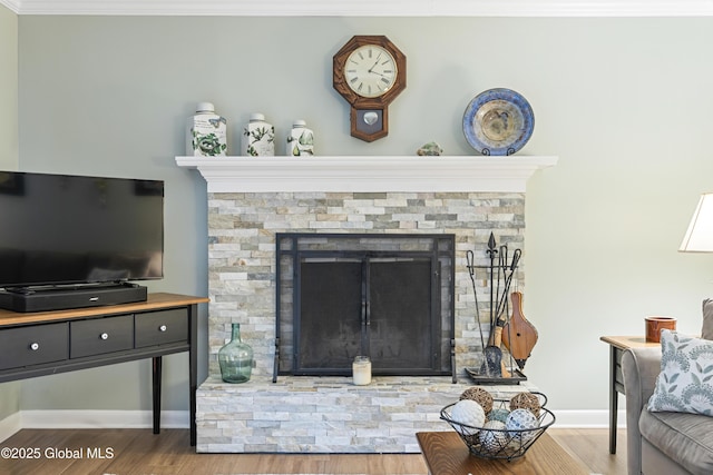 6458 Vosburgh Rd, Guilderland, NY 12009 - living room with wood finished floors, crown molding, and a fireplace with raised hearth