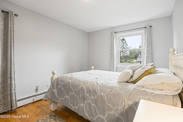 6458 Vosburgh Rd, Guilderland, NY 12009 - bedroom featuring wood finished floors and a baseboard radiator