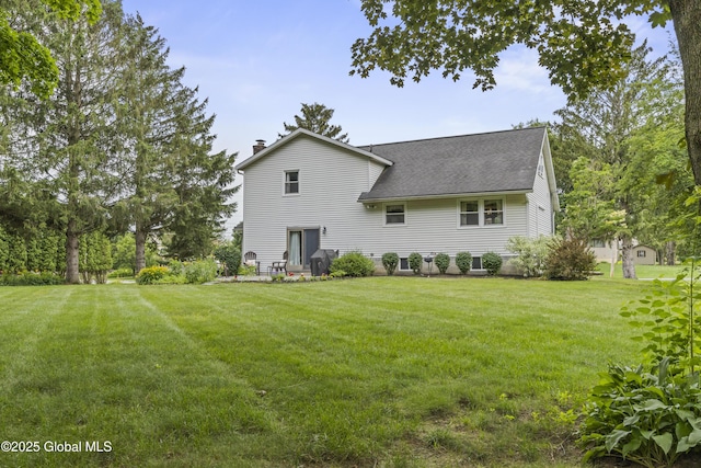6458 Vosburgh Rd, Guilderland, NY 12009 - rear view of property with a chimney, a yard, and a shingled roof