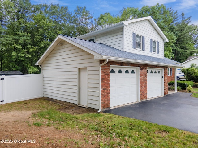 5012 Juniper Ln, Guilderland, NY 12303 - garage with asphalt driveway