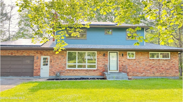 631 St Davids Ln, Niskayuna, NY 12309 - view of front of property featuring solar panels, a front lawn, and asphalt driveway