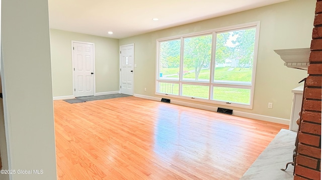 631 St Davids Ln, Niskayuna, NY 12309 - unfurnished living room with wood finished floors and recessed lighting