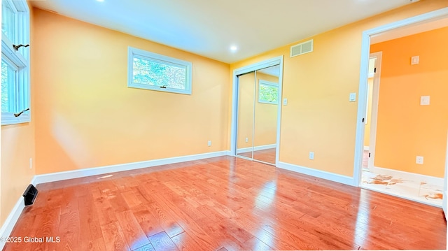631 St Davids Ln, Niskayuna, NY 12309 - unfurnished bedroom with light wood-style floors, recessed lighting, and a closet