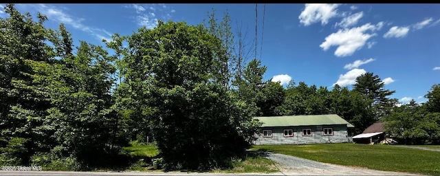 97 Library Ave, Warrensburg, NY 12885 - view of front facade with a front yard