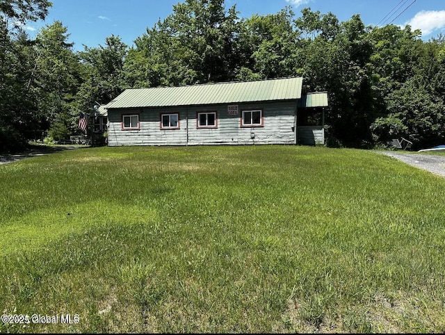 97 Library Ave, Warrensburg, NY 12885 - view of front of house featuring a front lawn and a metal roof