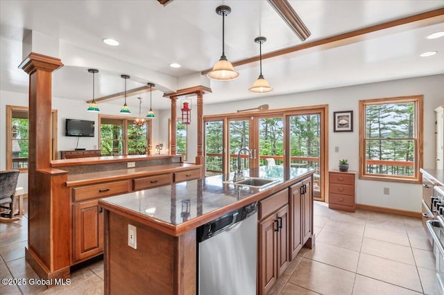 1062 S S Shore Rd, Hadley, NY 12835 - kitchen with dishwasher, ornate columns, a kitchen island with sink, french doors, and brown cabinets
