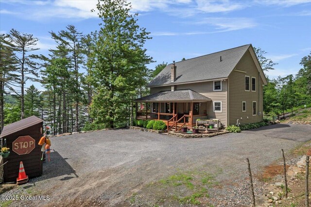 1062 S S Shore Rd, Hadley, NY 12835 - rear view of house with covered porch, driveway, and a shingled roof