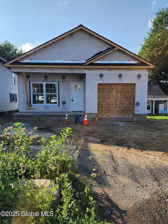 962 Florence Ave, Schenectady, NY 12303 - property under construction with a garage, driveway, and covered porch