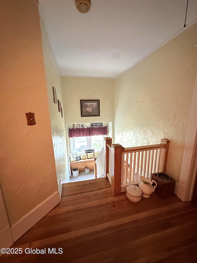 35 Walnut St, Canajoharie, NY 13317 - stairway featuring wood finished floors and a textured wall