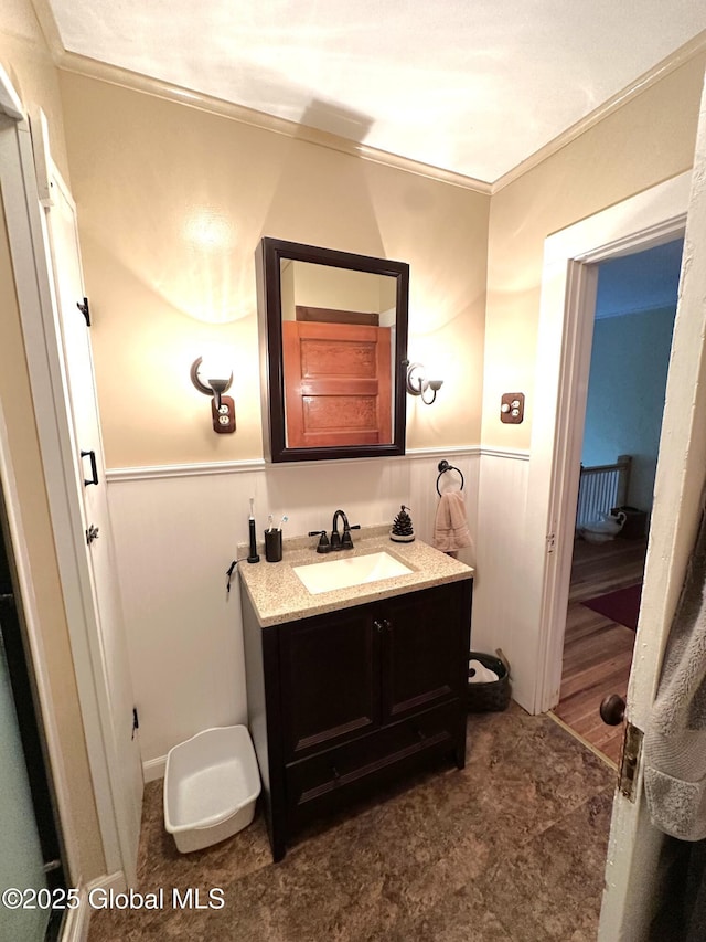 35 Walnut St, Canajoharie, NY 13317 - bathroom with vanity, a wainscoted wall, and crown molding