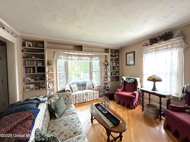 35 Walnut St, Canajoharie, NY 13317 - living room with hardwood / wood-style floors, built in features, and crown molding