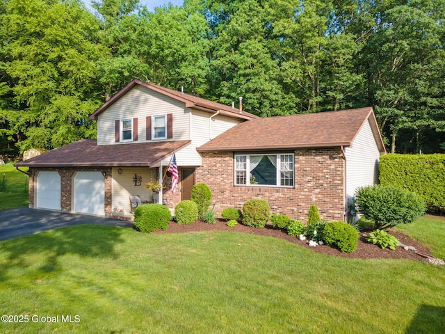 23 Tokay Ln, Colonie, NY 12309 - view of front of house with brick siding, driveway, a front lawn, a shingled roof, and a garage