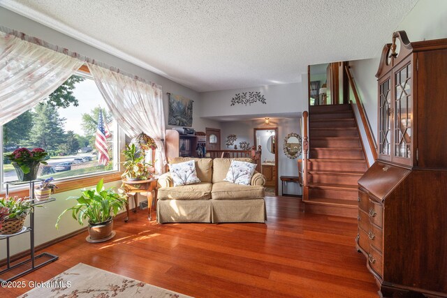 23 Tokay Ln, Colonie, NY 12309 - living room with a textured ceiling, stairway, and wood finished floors