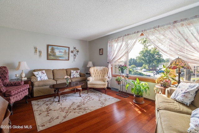 23 Tokay Ln, Colonie, NY 12309 - living area with a textured ceiling and wood finished floors