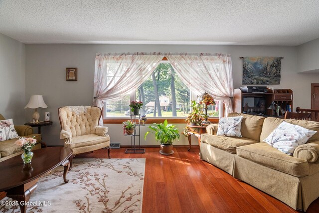 23 Tokay Ln, Colonie, NY 12309 - living room with wood finished floors and a textured ceiling