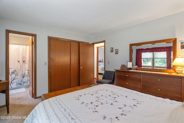 23 Tokay Ln, Colonie, NY 12309 - bedroom with a closet, light colored carpet, and a textured ceiling