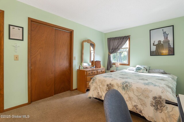 23 Tokay Ln, Colonie, NY 12309 - carpeted bedroom featuring a closet and baseboards