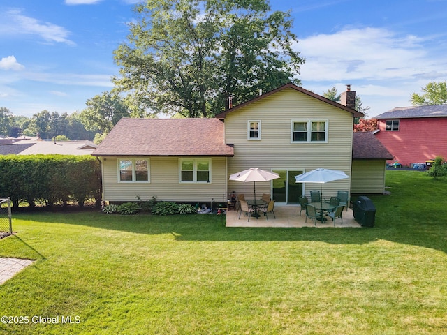 23 Tokay Ln, Colonie, NY 12309 - back of house with a patio, a lawn, and roof with shingles