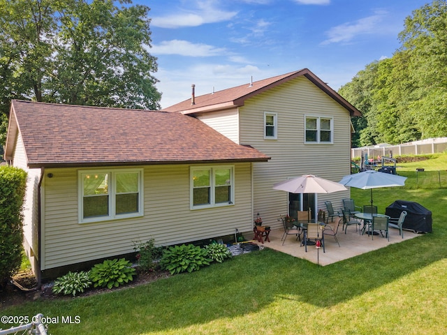 23 Tokay Ln, Colonie, NY 12309 - rear view of property with roof with shingles and a patio area