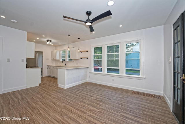 280 Vley Rd, Glenville, NY 12302 - kitchen featuring ceiling fan, white cabinets, recessed lighting, wood finished floors, and healthy amount of natural light