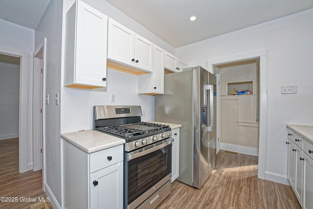 280 Vley Rd, Glenville, NY 12302 - kitchen with stainless steel appliances, light wood-type flooring, light countertops, white cabinets, and recessed lighting
