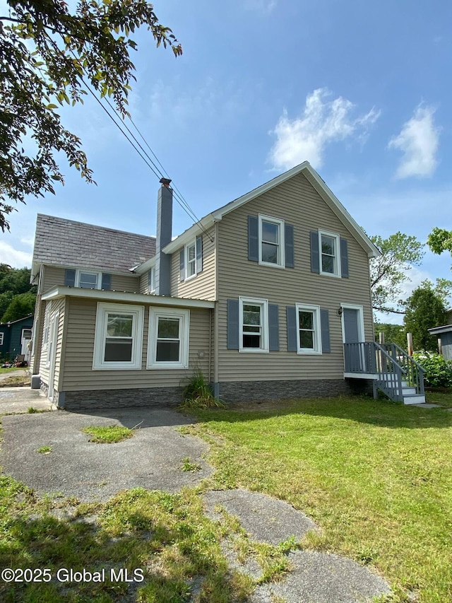 11 4th Ave, Whitehall, NY 12887 - view of front of house featuring a chimney and a front lawn