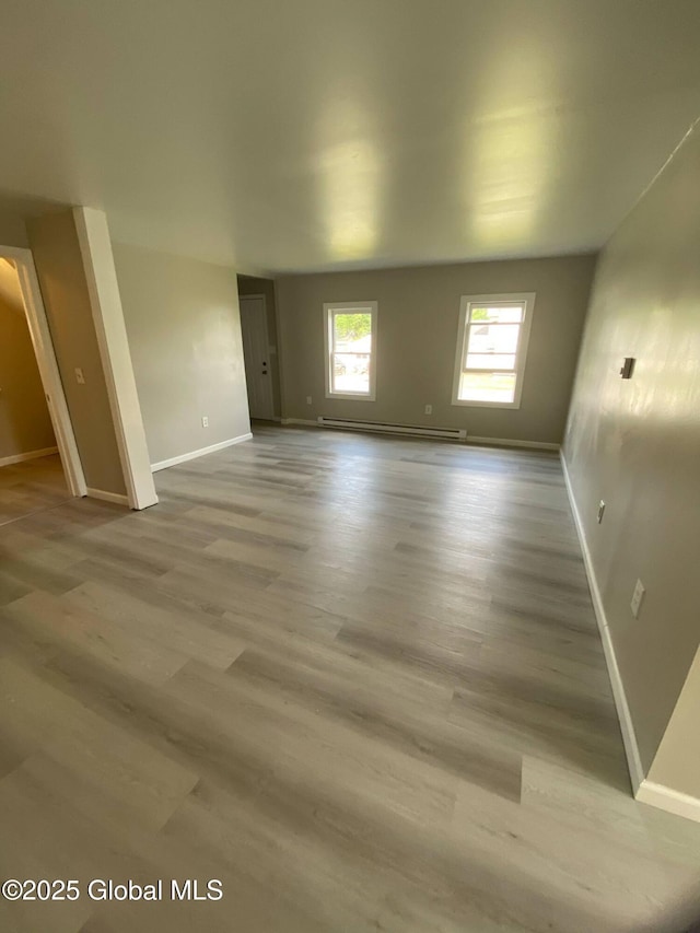 11 4th Ave, Whitehall, NY 12887 - spare room with baseboard heating and wood finished floors