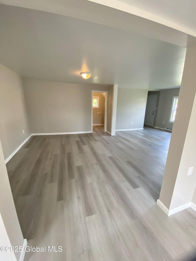 11 4th Ave, Whitehall, NY 12887 - empty room with wood finished floors and baseboard heating