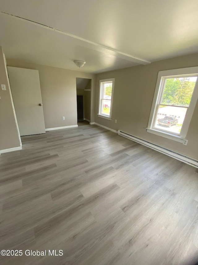 11 4th Ave, Whitehall, NY 12887 - spare room with a baseboard heating unit and wood finished floors