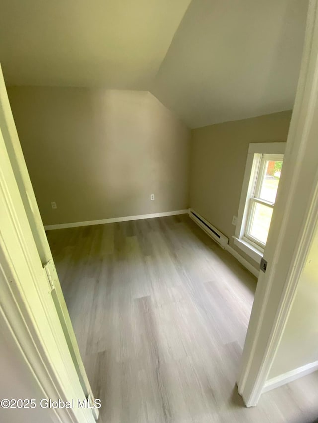11 4th Ave, Whitehall, NY 12887 - bonus room with a baseboard radiator, wood finished floors, and vaulted ceiling