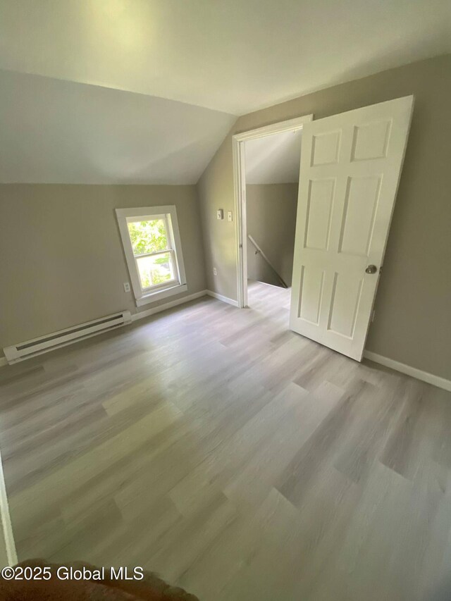 11 4th Ave, Whitehall, NY 12887 - bonus room featuring a baseboard radiator, light wood-style floors, and vaulted ceiling