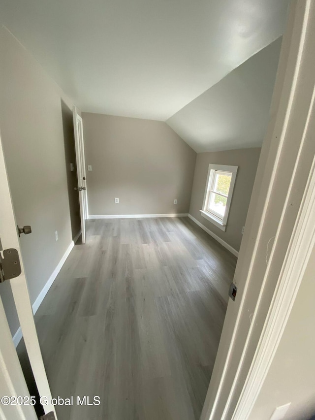 11 4th Ave, Whitehall, NY 12887 - additional living space with wood finished floors and lofted ceiling
