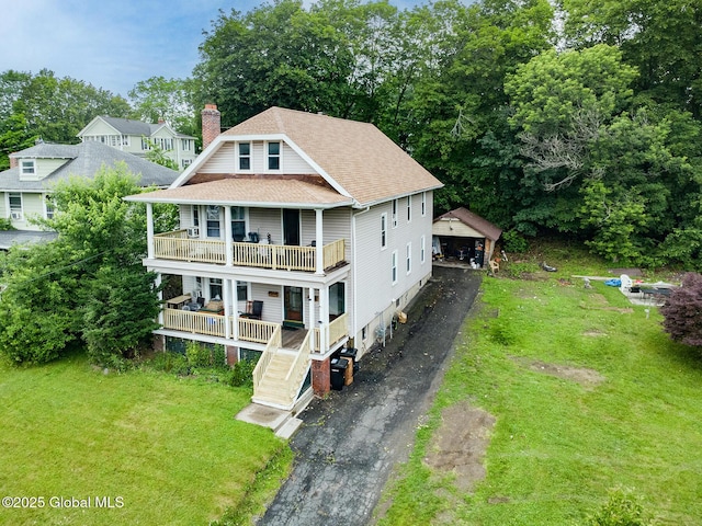 2303 Burdett Ave, Troy, NY 12180 - view of front facade with a balcony, a front yard, a shingled roof, and covered porch