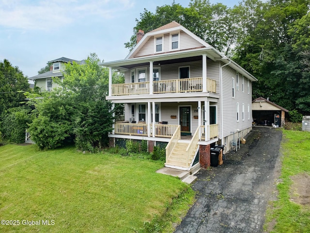 2303 Burdett Ave, Troy, NY 12180 - view of front of property with a balcony, a chimney, a porch, an outbuilding, and a front yard