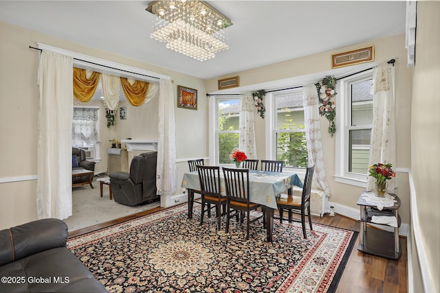 2303 Burdett Ave, Troy, NY 12180 - dining area featuring a chandelier and wood finished floors