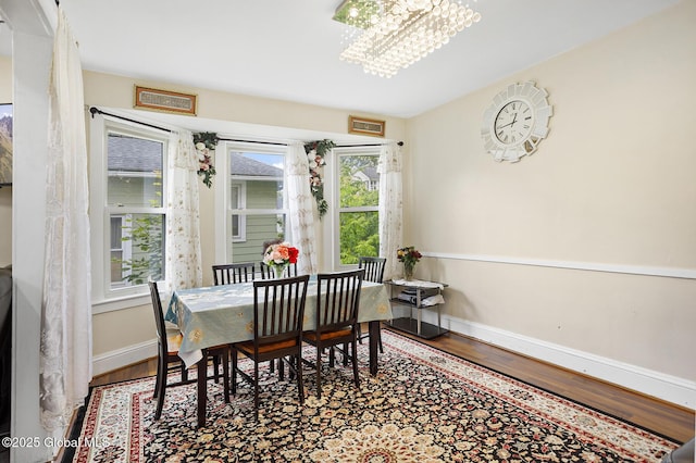 2303 Burdett Ave, Troy, NY 12180 - dining room with wood finished floors and a chandelier