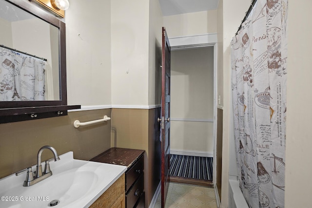 2303 Burdett Ave, Troy, NY 12180 - full bath featuring vanity, shower / bath combo, and backsplash