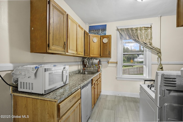 2303 Burdett Ave, Troy, NY 12180 - kitchen featuring white appliances and brown cabinets